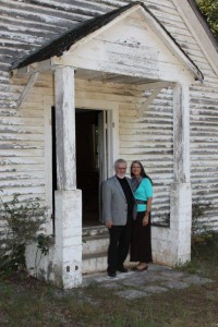 Dr. Henry and Pastor Donna Wright in front of the original chapel in Georgia